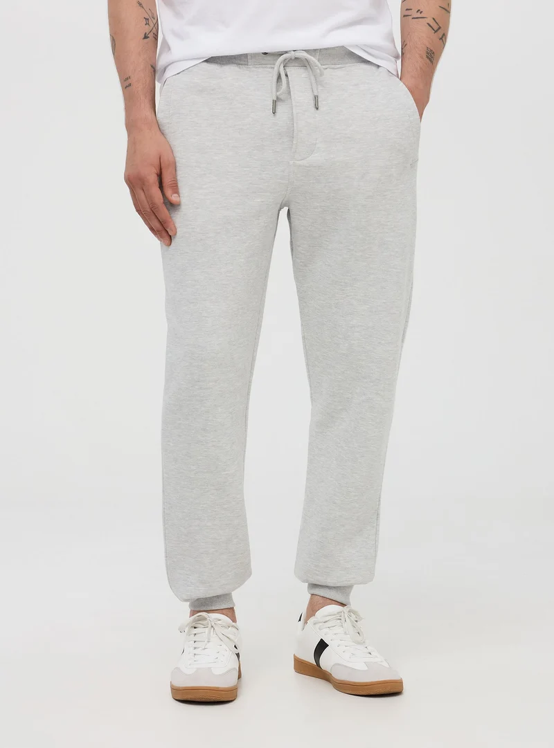 Pantaloni tuta pesanti con coulisse e polsini