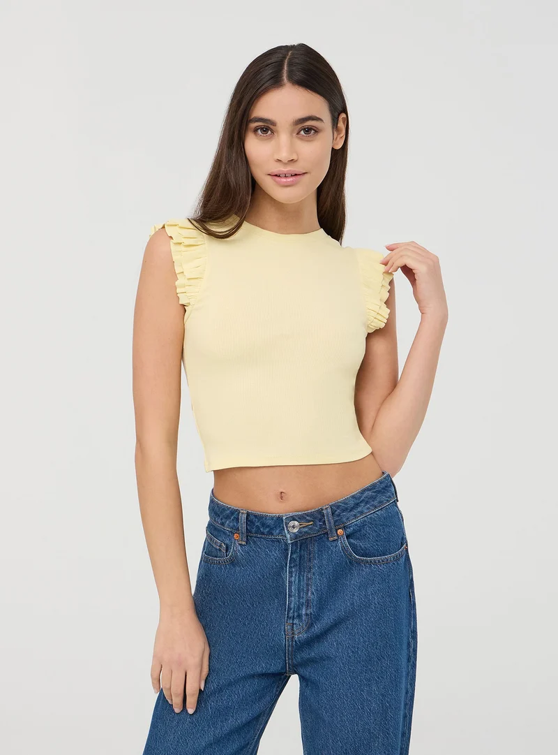 T-shirt crop con maniche a balze