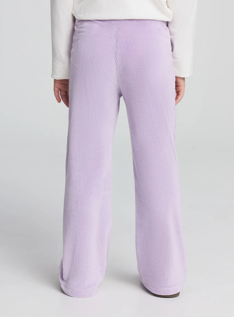 Leggings zampa a coste con fiocchi