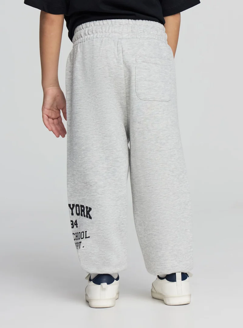 Pantaloni tuta con scritta