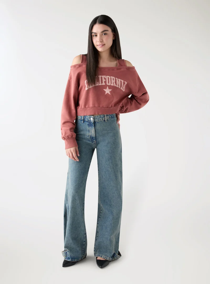 Jeans wide leg con fondo regolabile