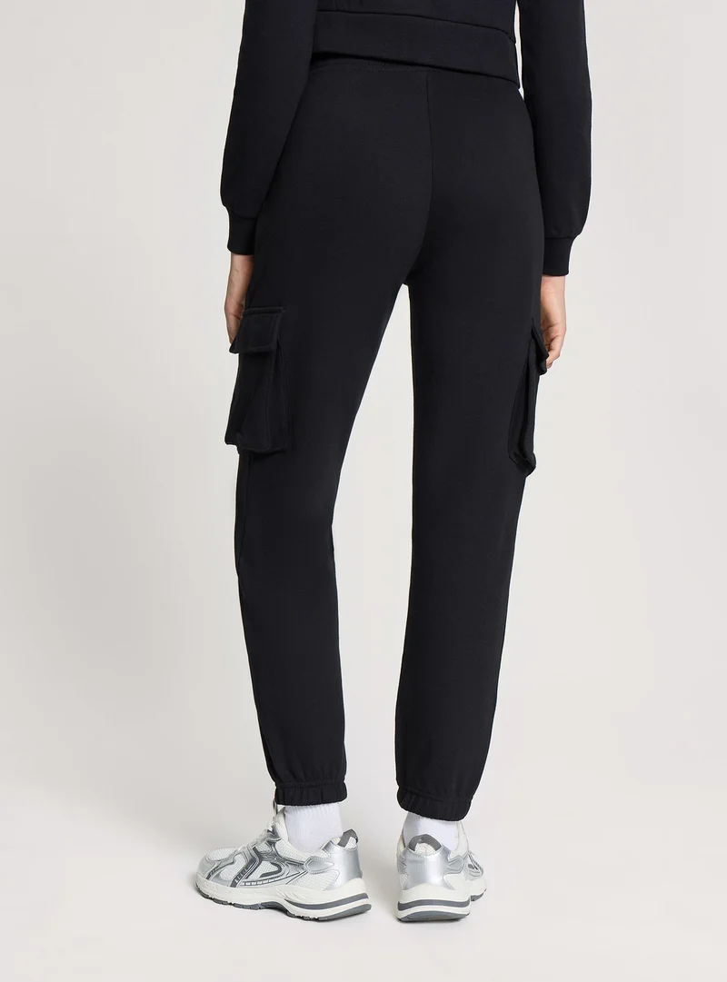 Pantalone ginnico cargo a vita alta