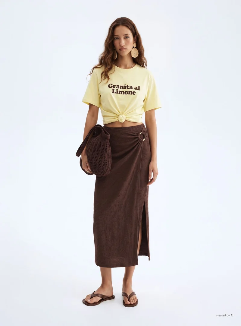 T-shirt ampia con scritta