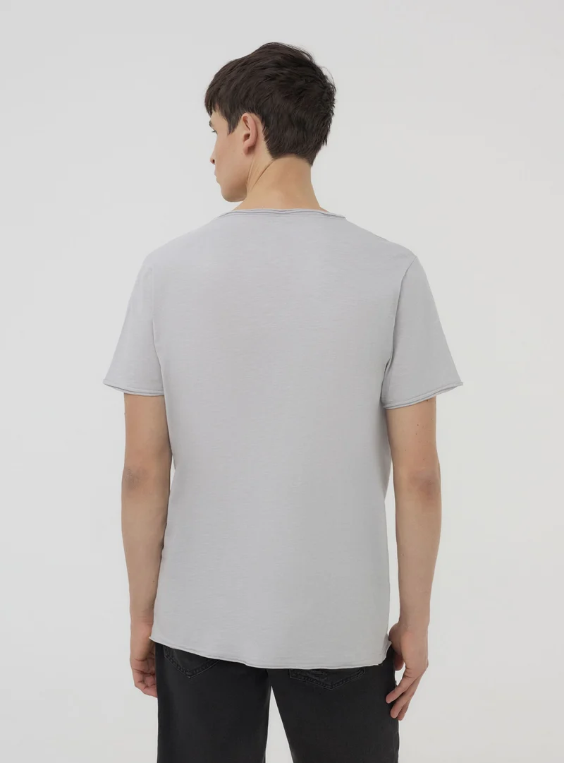 T-shirt taglio vivo tessuto fiammato