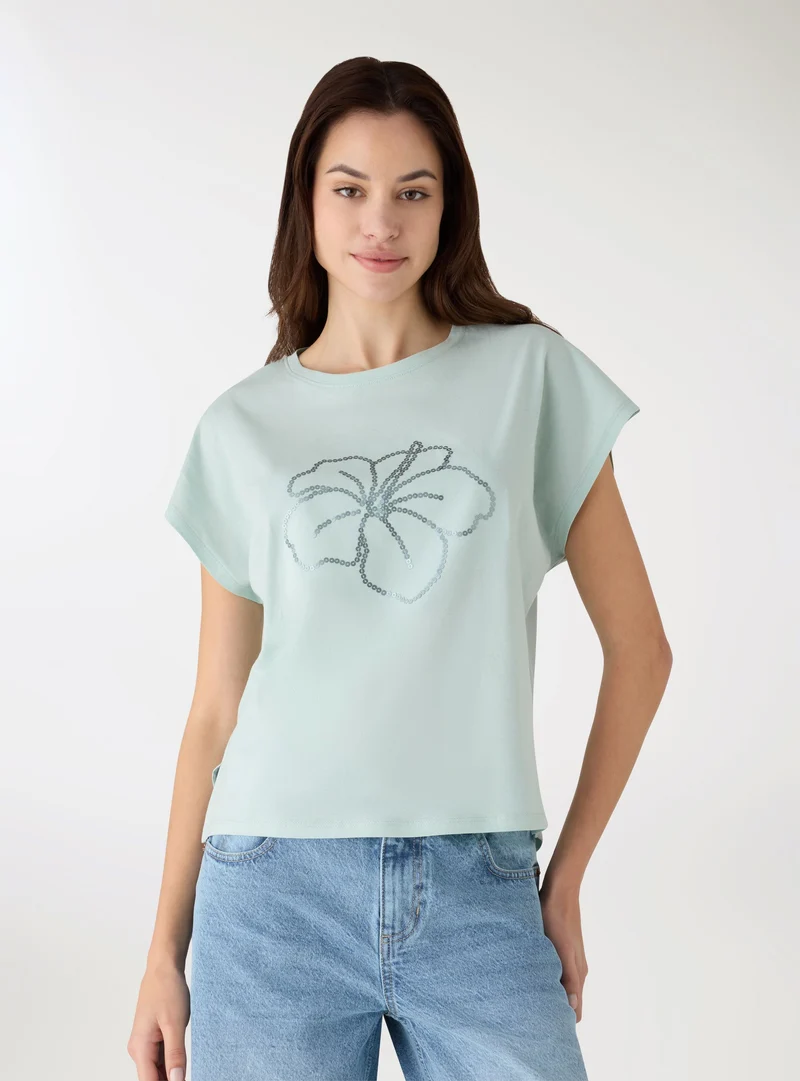 T-shirt con stampa fiori e paillettes