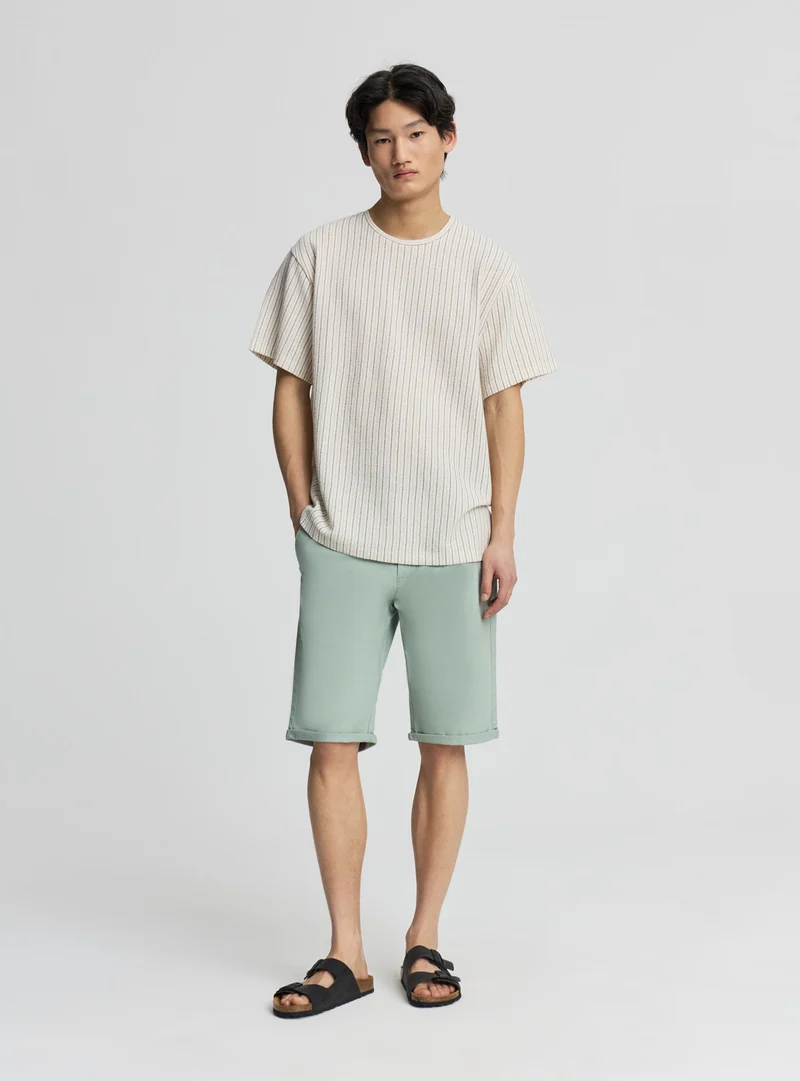 T-shirt a righe con effetto crochet