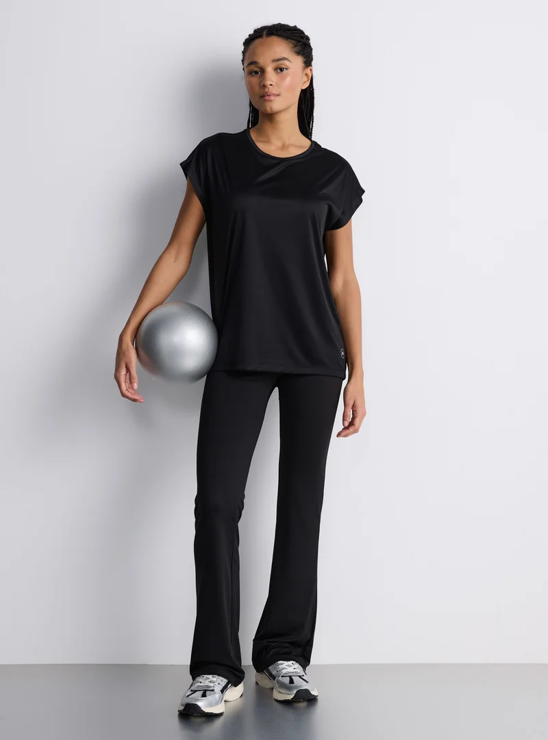 T-shirt sportiva ampia tinta unita