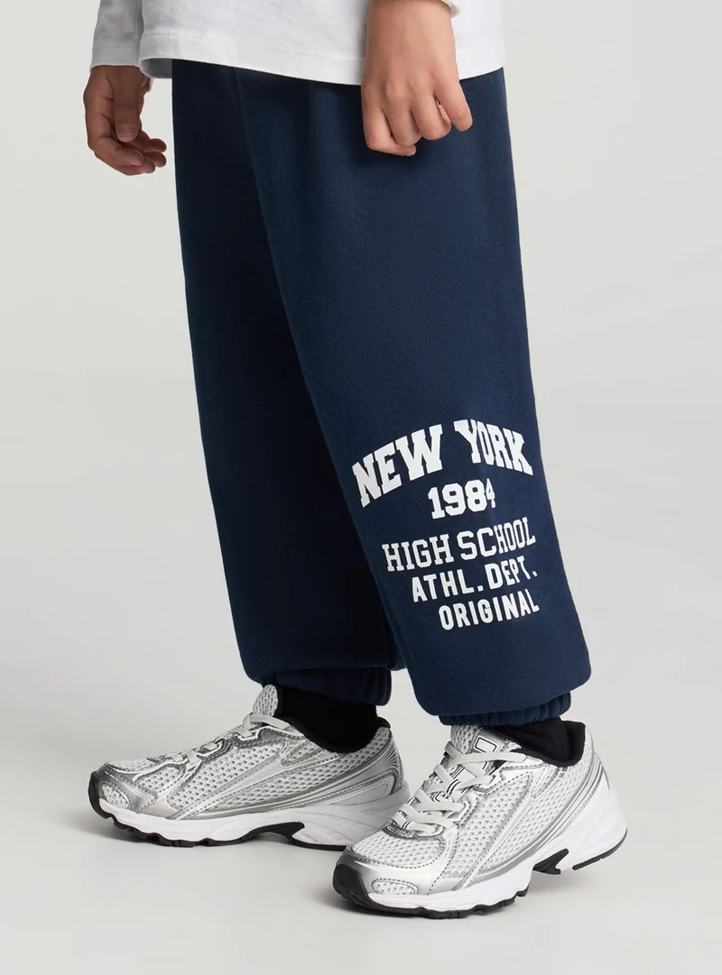 Pantaloni tuta con scritta