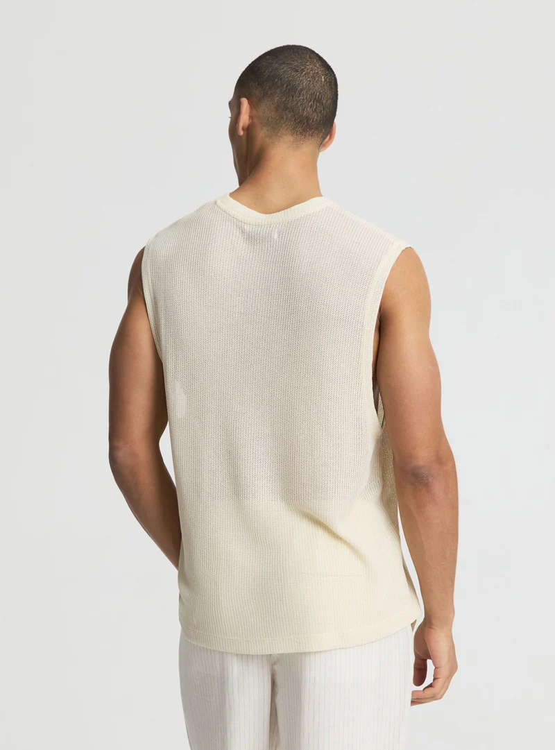 T-shirt smanicata boxy effetto maglia a tinta unita