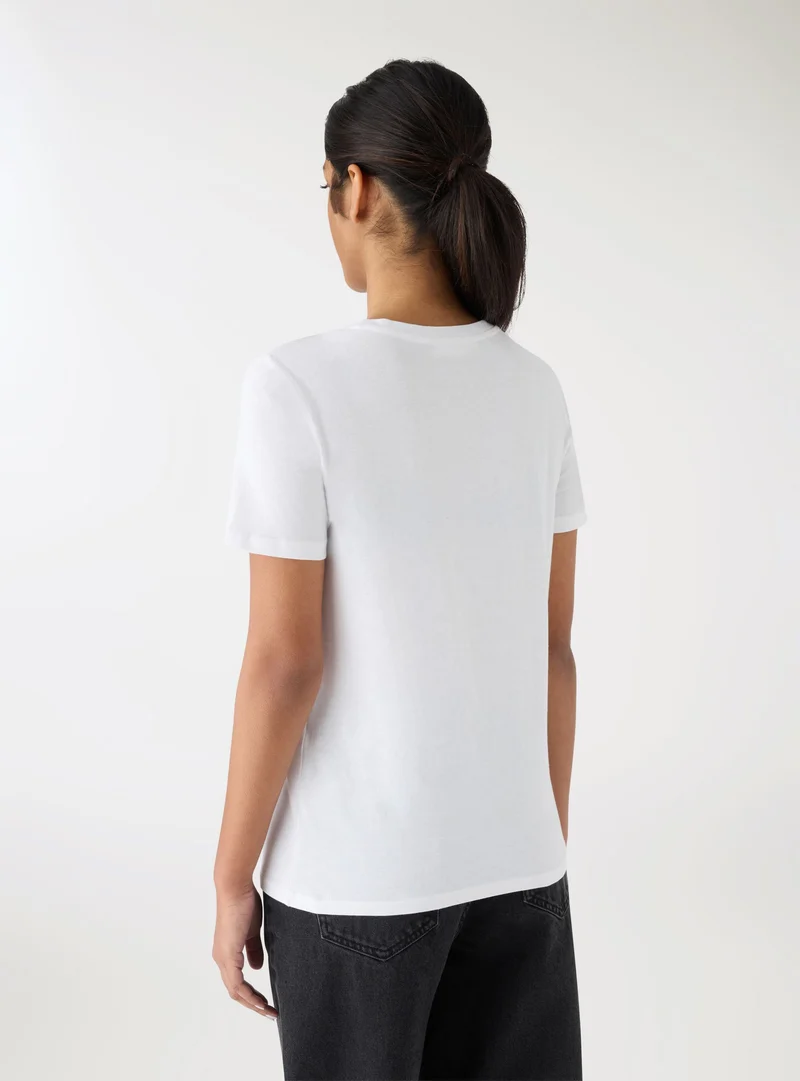 T-shirt con stampa fiori e scritta