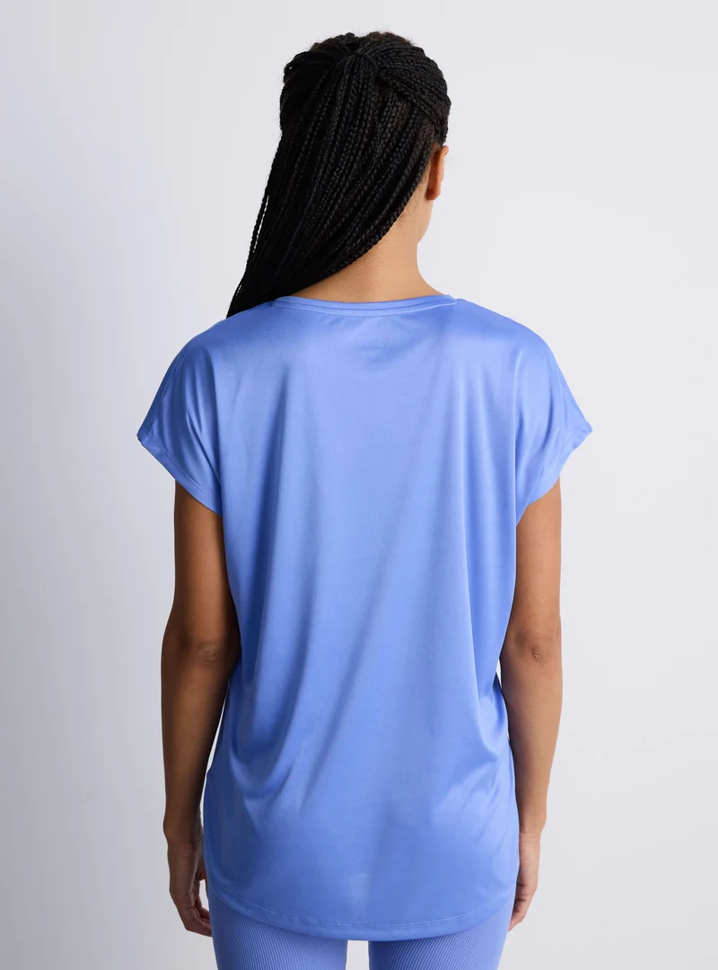 T-shirt sportiva ampia tinta unita