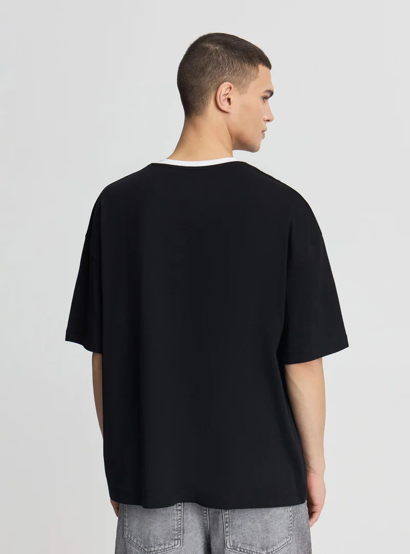 T-shirt boxy fit con numero