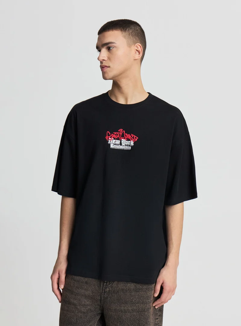 T-shirt oversize con stampa fronte/retro