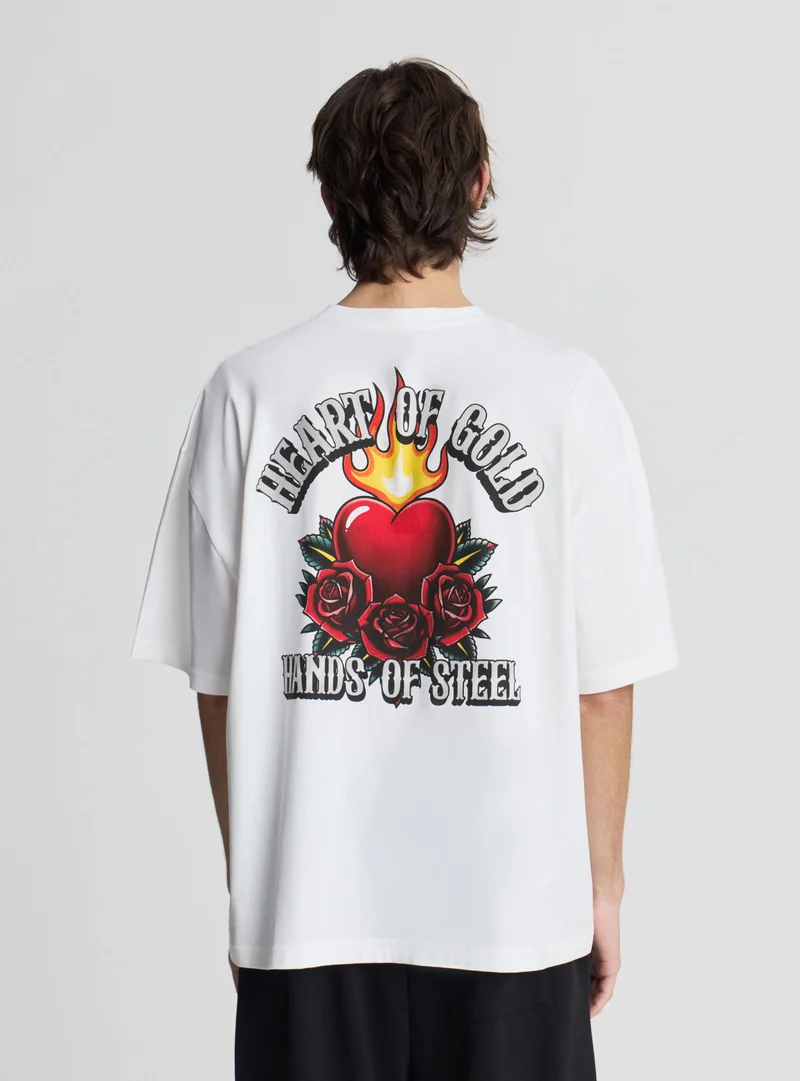 T-shirt boxy fit con stampa fronte/retro