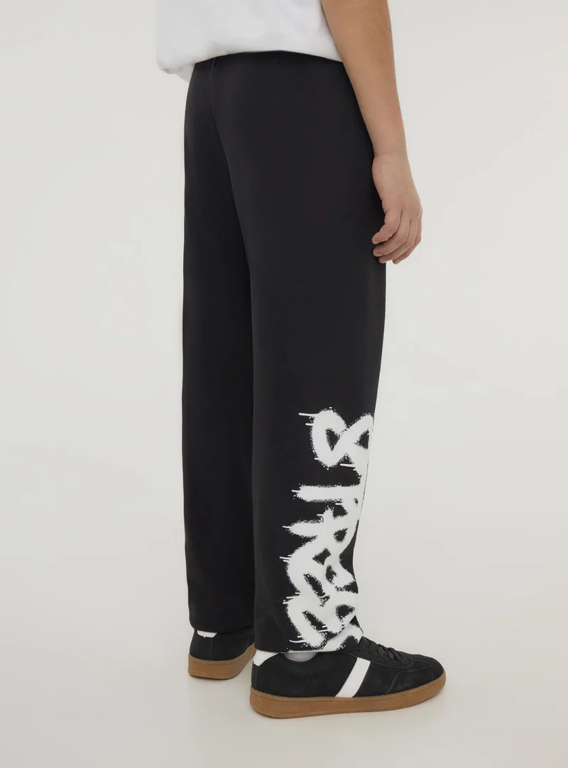 Pantaloni tuta stampa graffiti