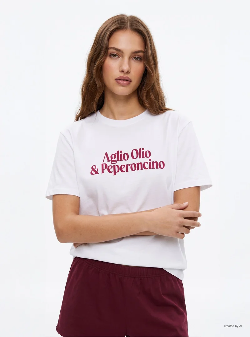 T-shirt ampia con scritta