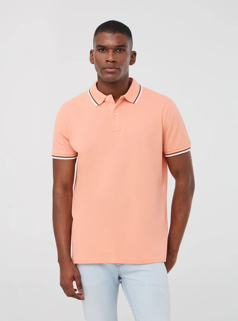 Polo con profili a contrasto