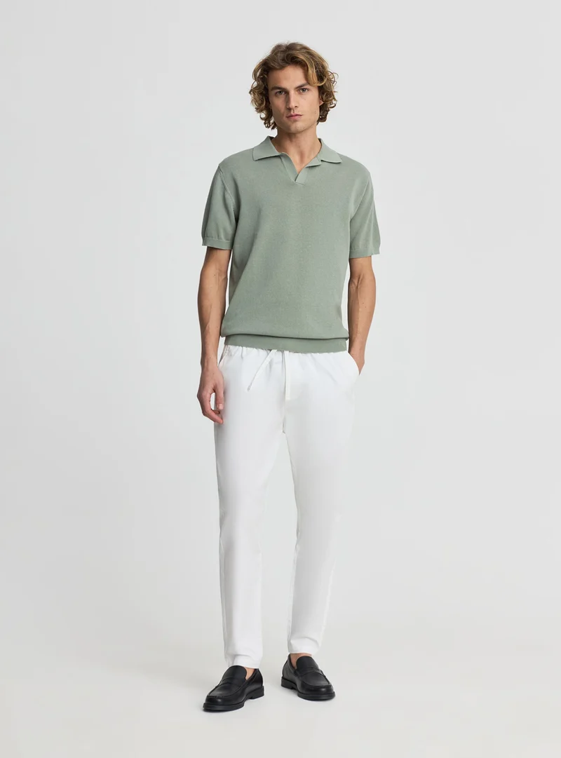 T-shirt polo in maglia tinta unita