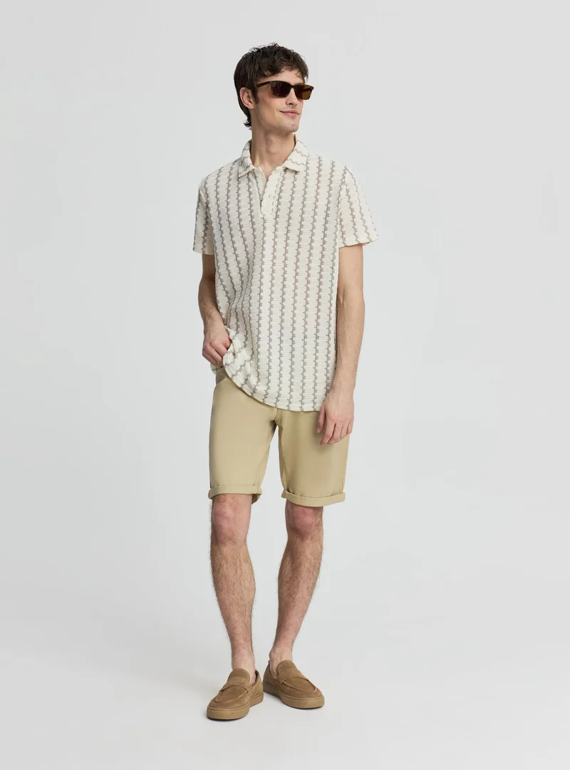 T-shirt polo a righe zig zag