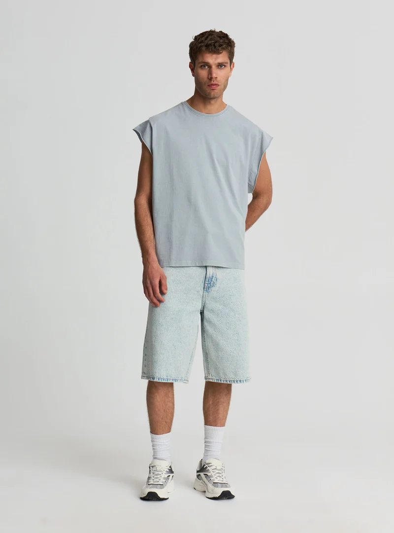 T-shirt boxy a tinta unita con maniche ad aletta