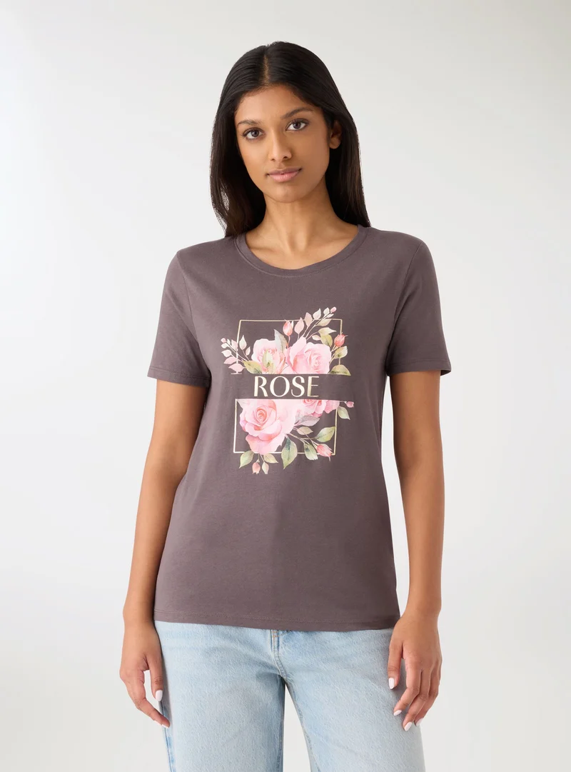 T-shirt con stampa fiori e scritta