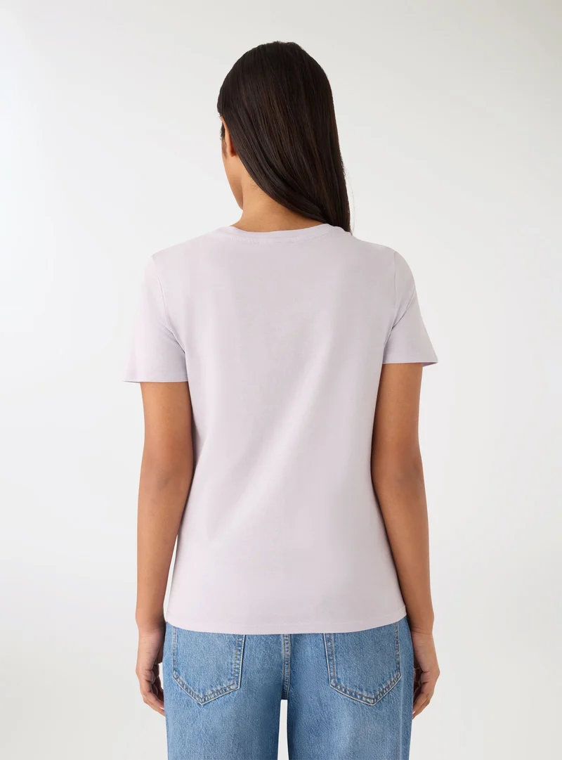 T-shirt con stampa fiori e scritta