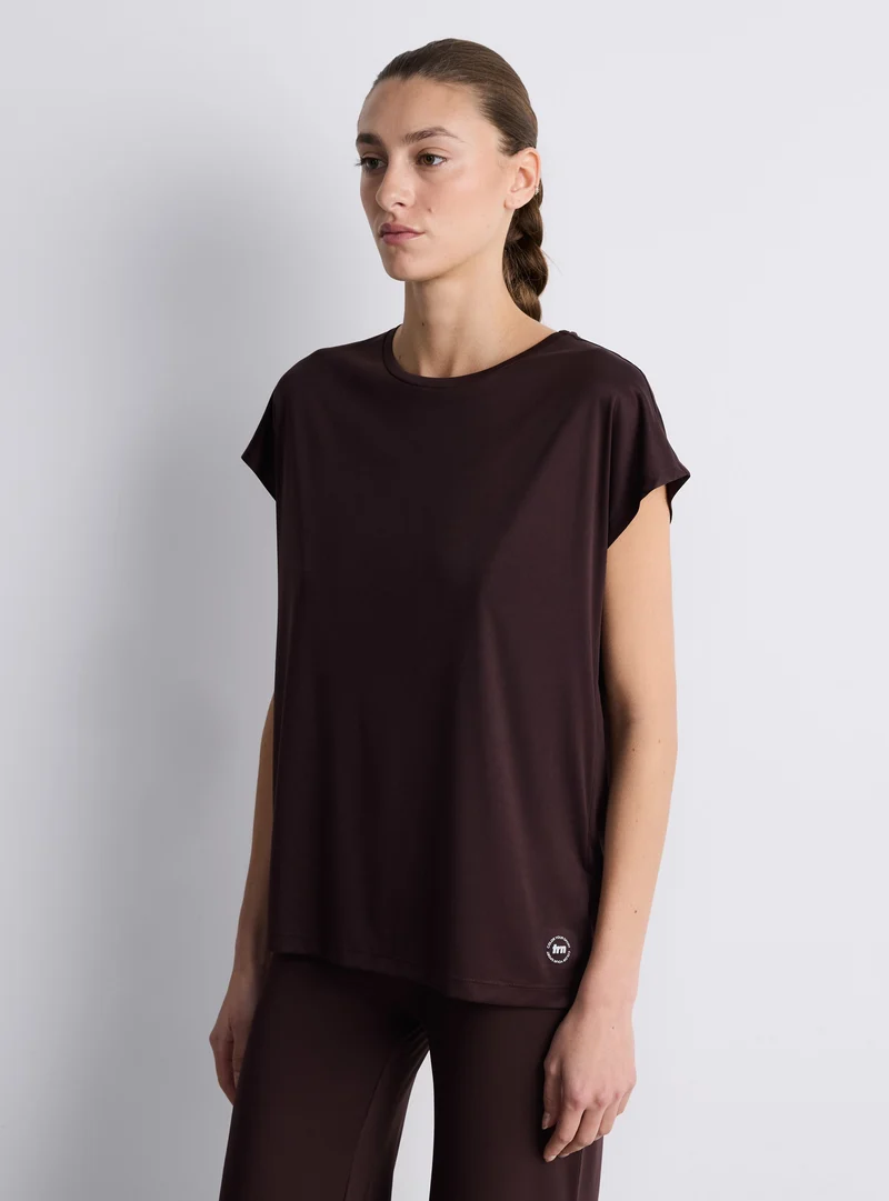 T-shirt sportiva ampia tinta unita