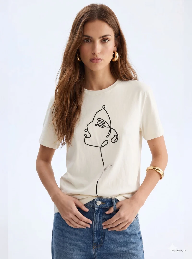 T-shirt con ricamo volto