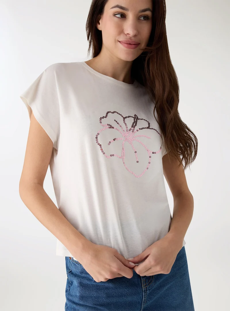 T-shirt con stampa fiori e paillettes