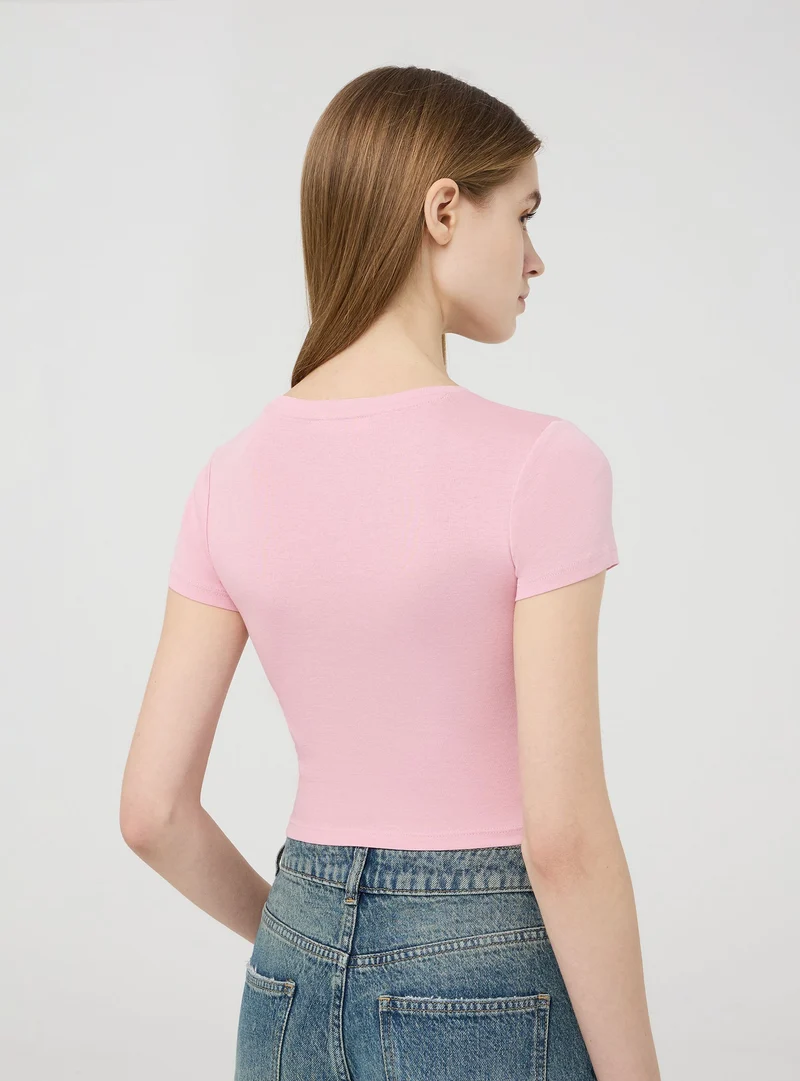 T-shirt crop aderente tinta unita