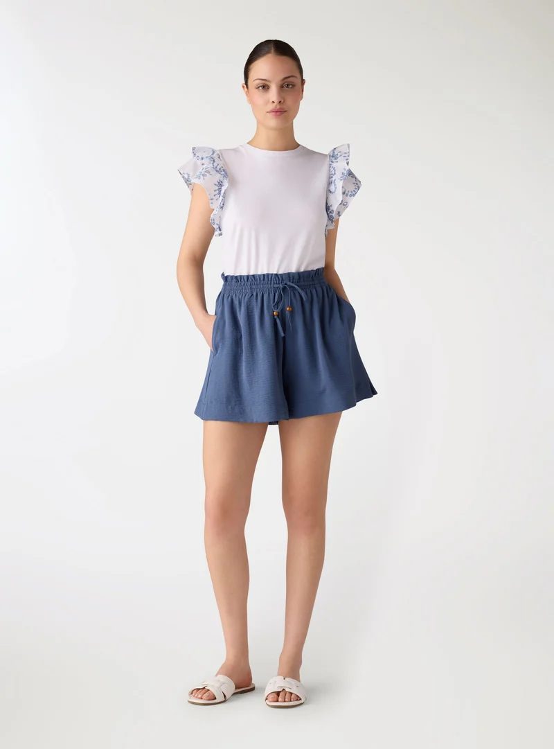 Shorts morbidi a tinta unita con coulisse