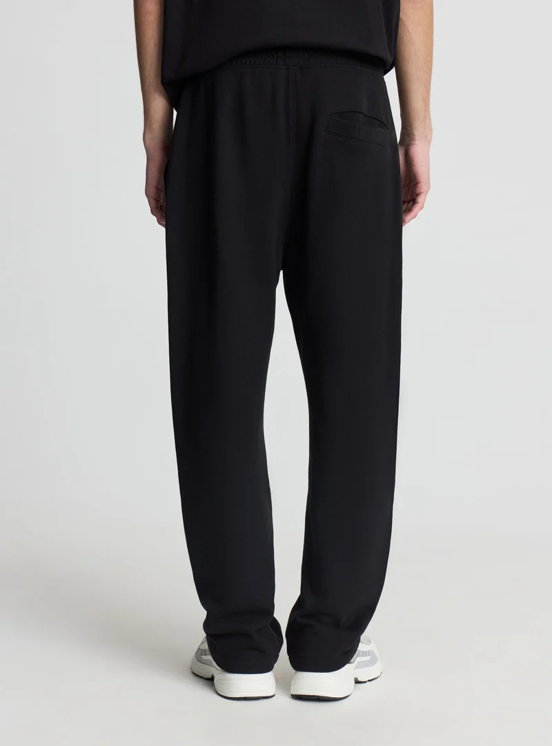 Pantaloni tuta a tinta unita