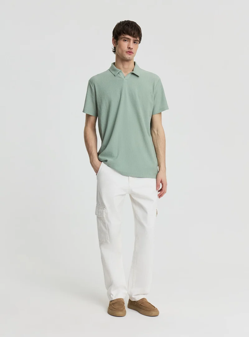T-shirt polo a tinta unita effetto maglia