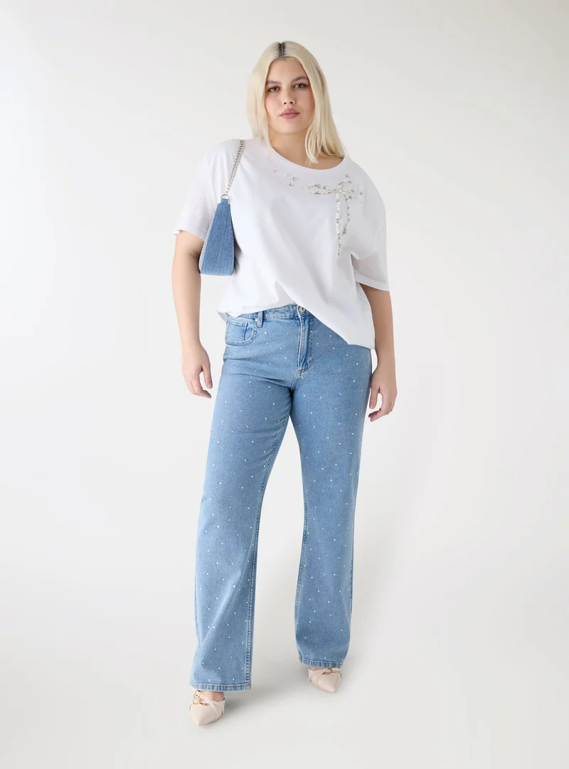 T-shirt con applicazioni a fiocco