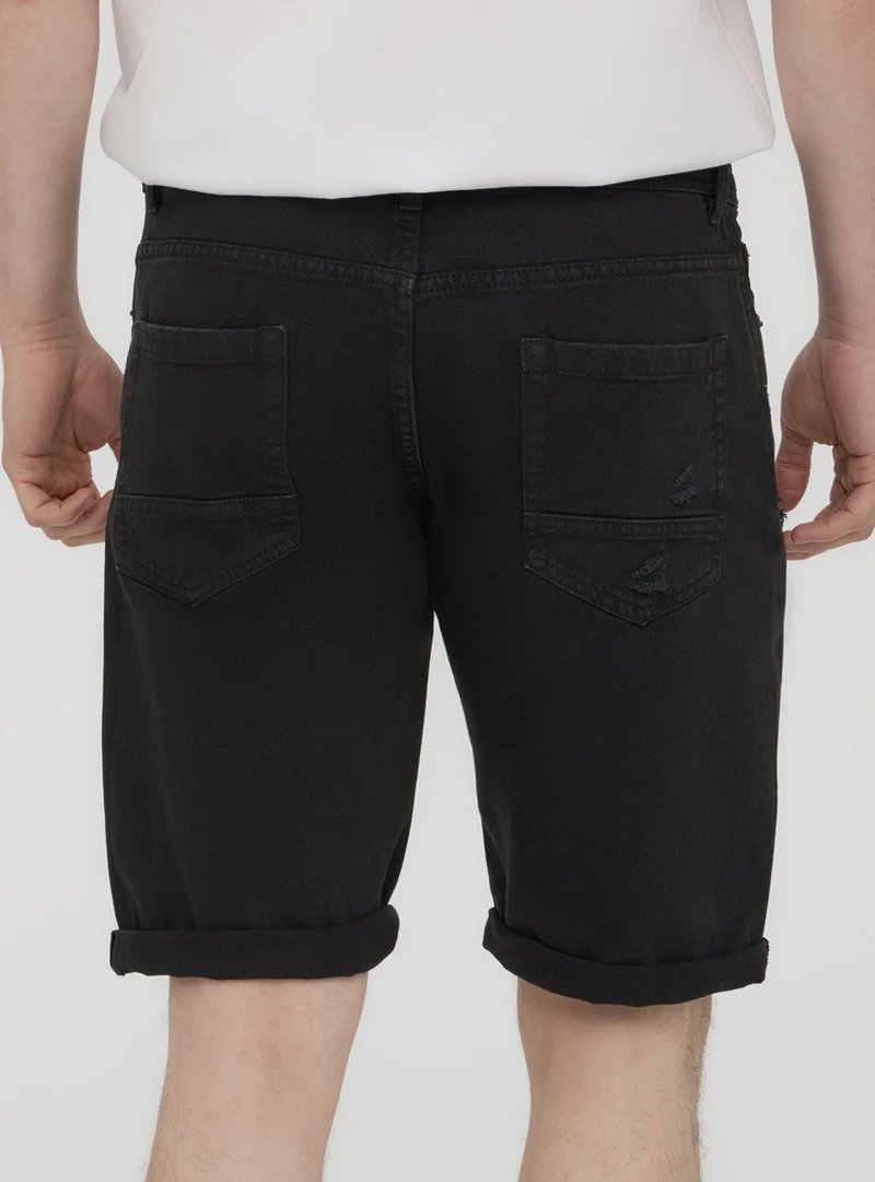Bermuda in denim con strappi