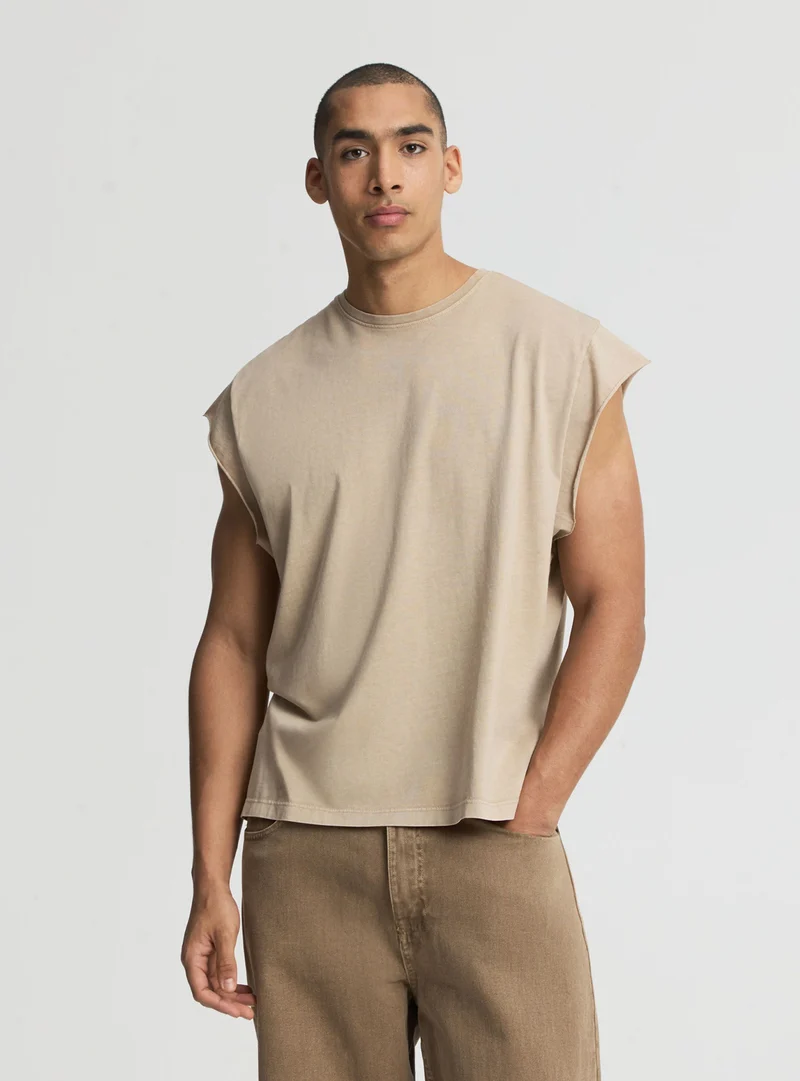 T-shirt boxy a tinta unita con maniche ad aletta
