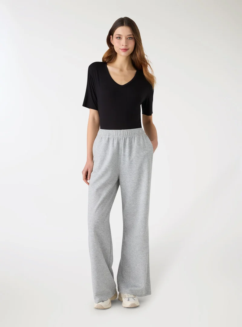Pantaloni tuta wide leg a tinta unita