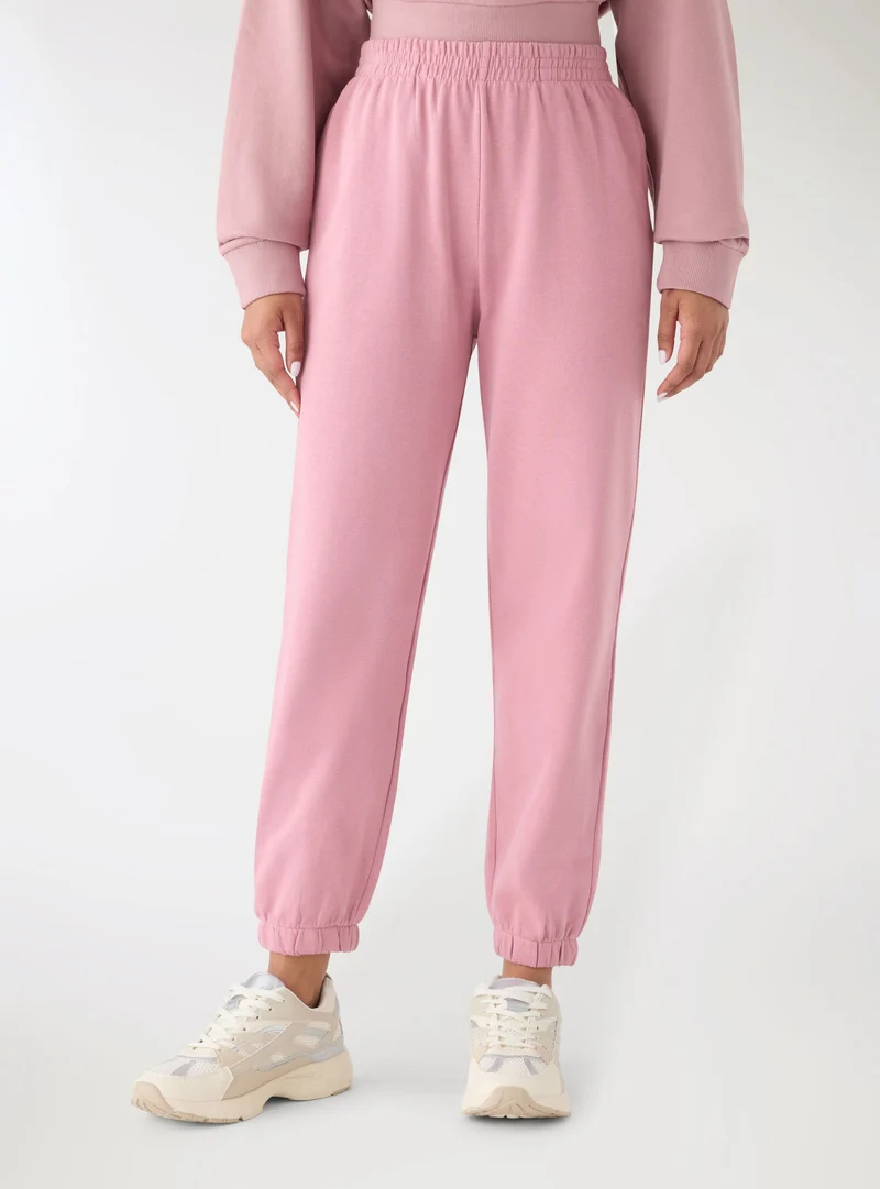 Pantaloni tuta vita alta tinta unita