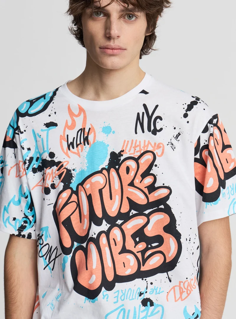 T-shirt relaxed con stampa graffiti allover