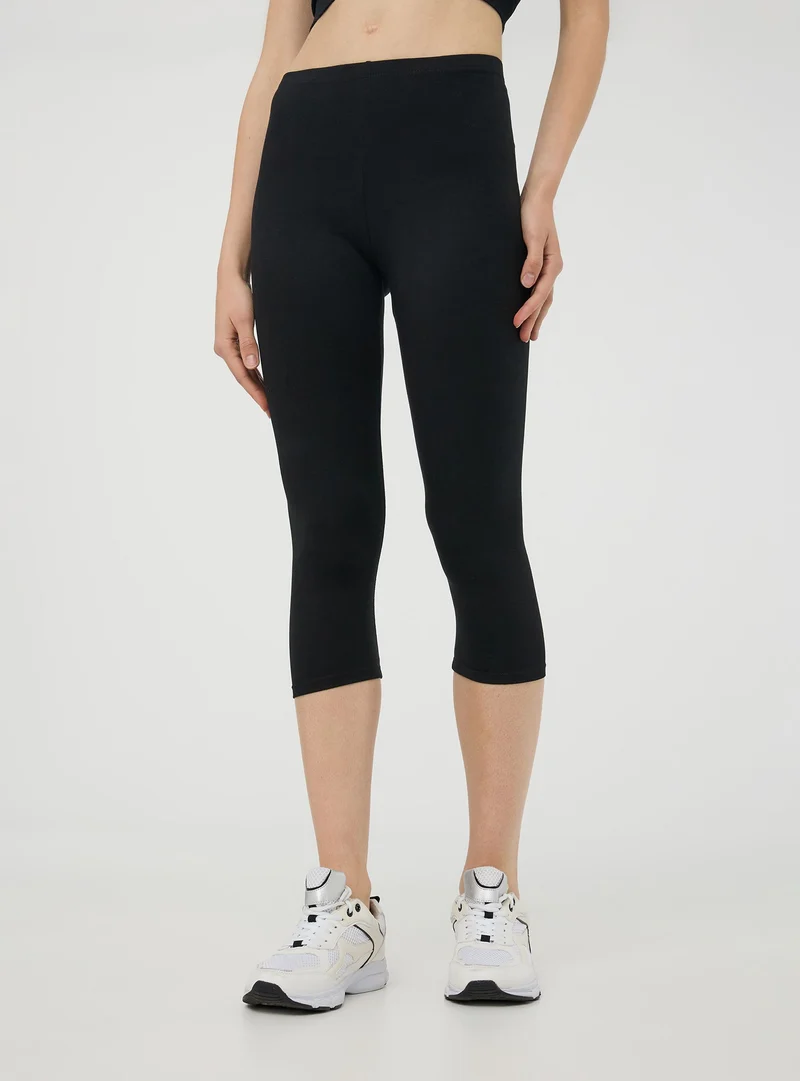 Leggings tre quarti tinta unita