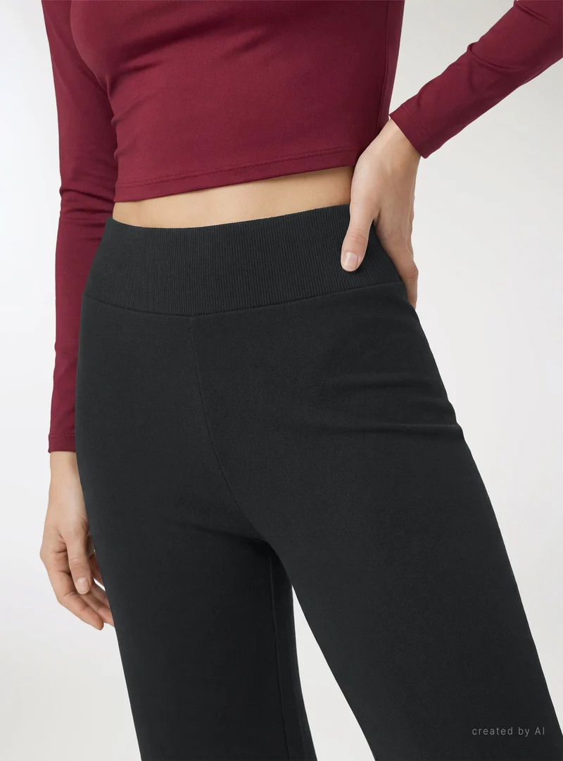 Leggings a zampa tinta unita