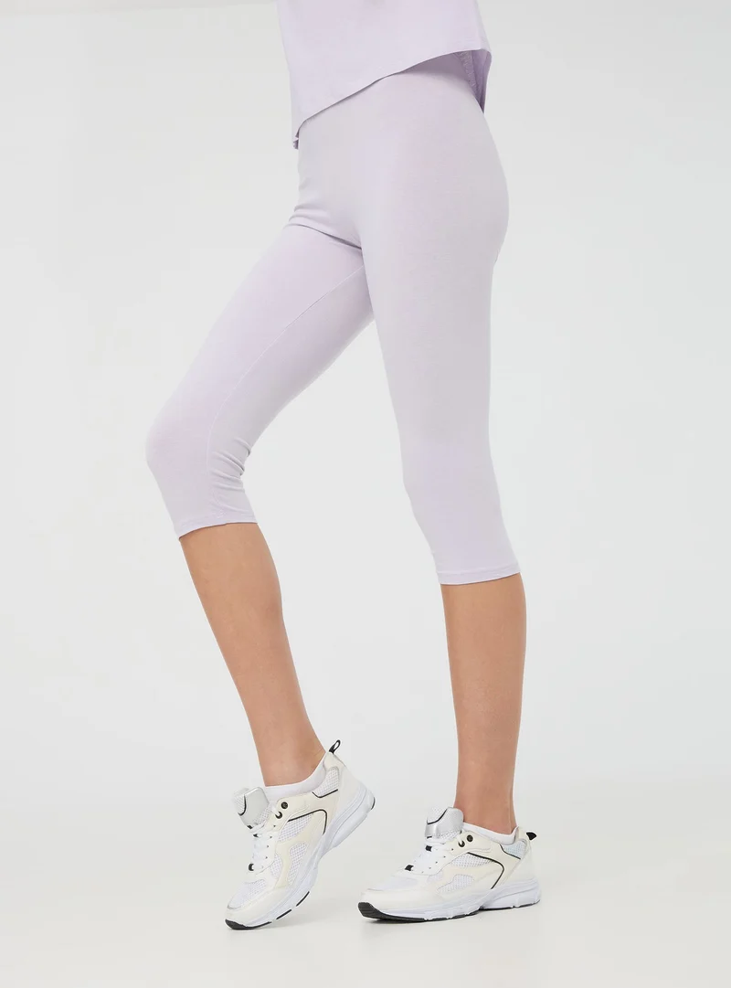 Leggings tre quarti tinta unita