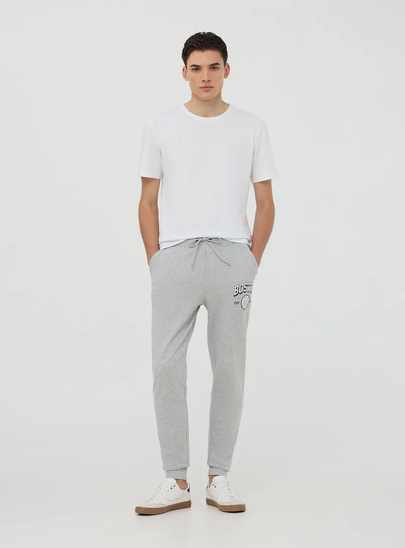 Pantaloni tuta con coulisse e stampa