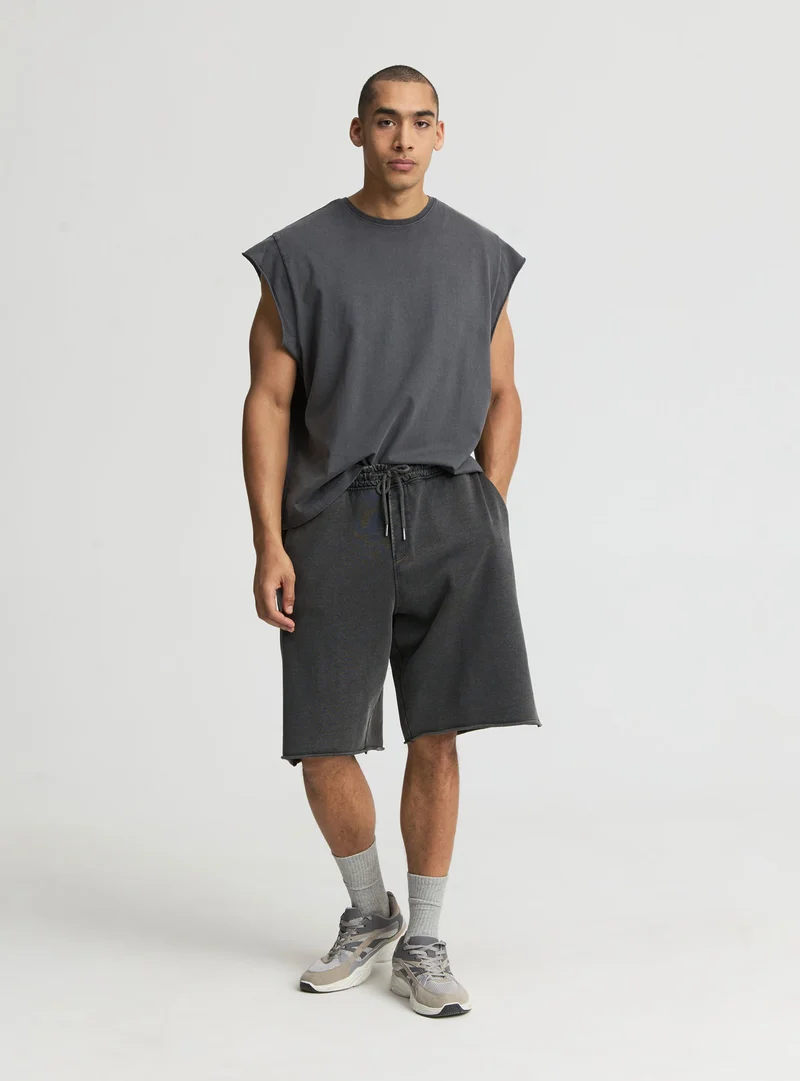 T-shirt boxy a tinta unita con maniche ad aletta