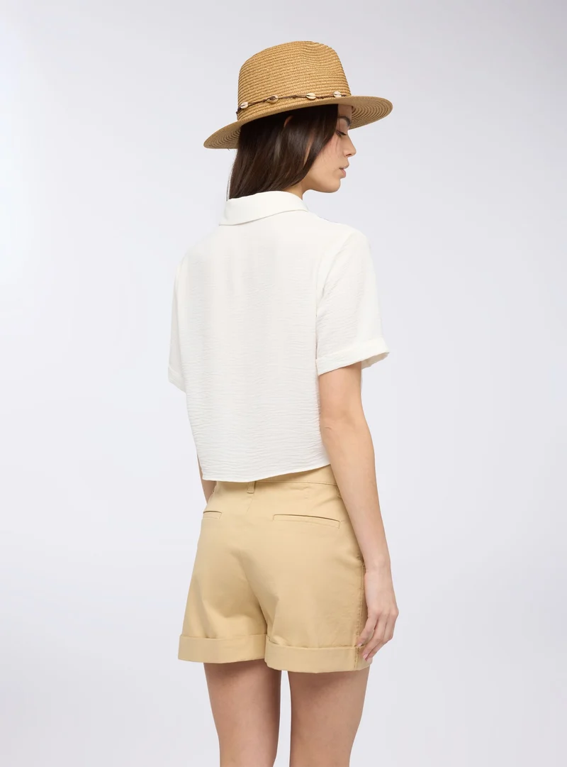 Pantaloncini con tasche alla francese