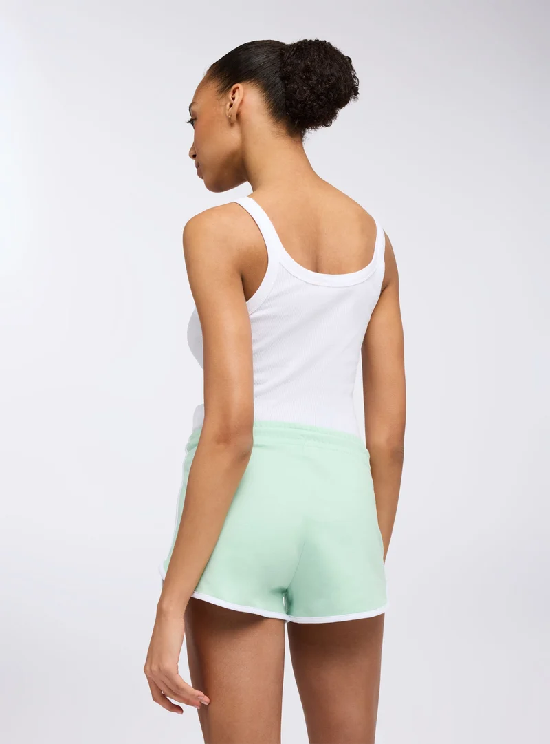 Shorts tuta leggeri con profili e stampa college