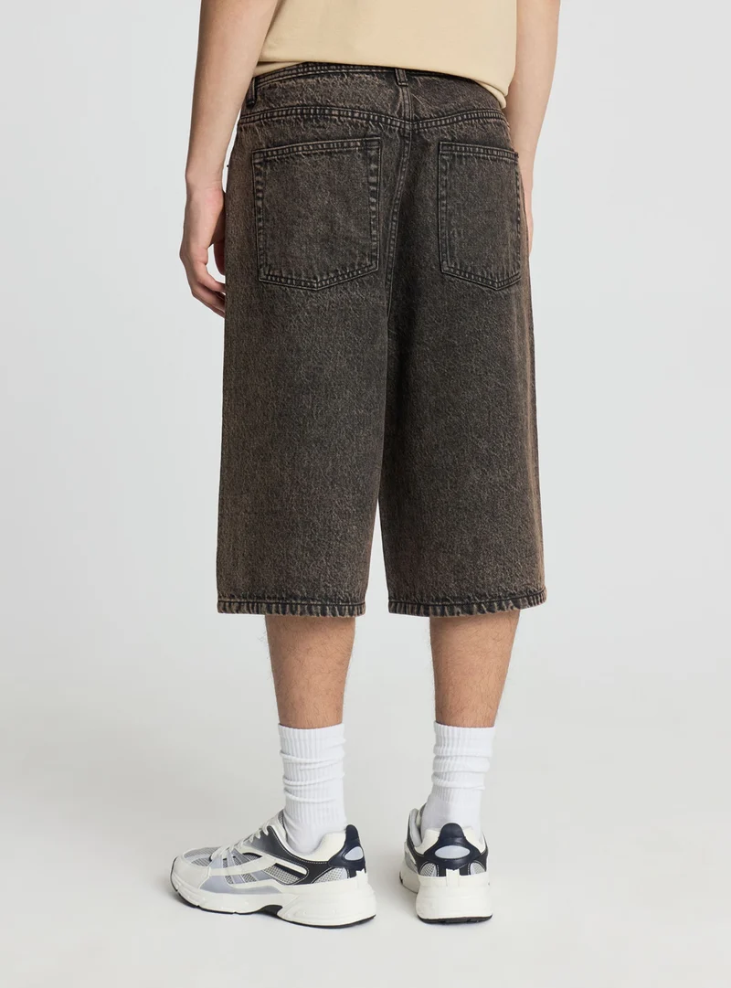 Pantaloncini jeans super baggy a tinta unita