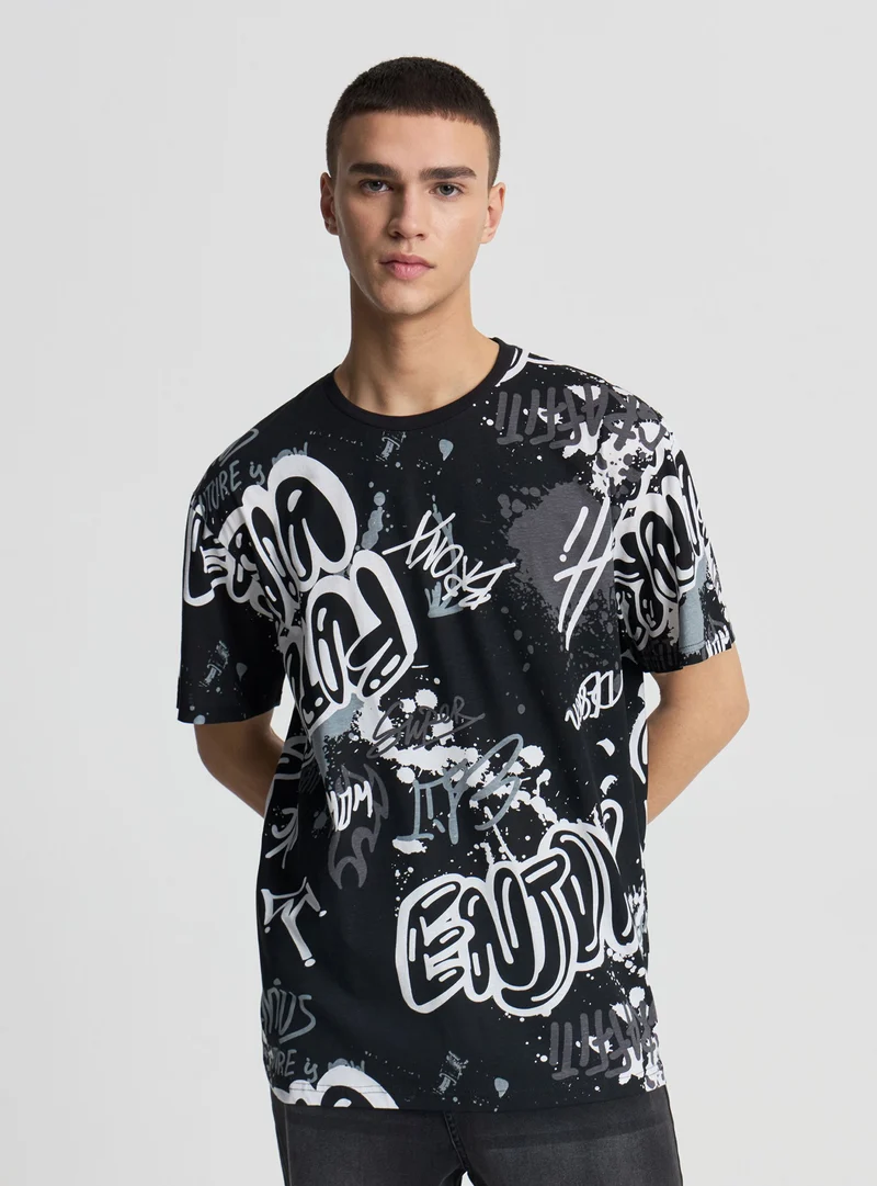 T-shirt relaxed con stampa graffiti allover