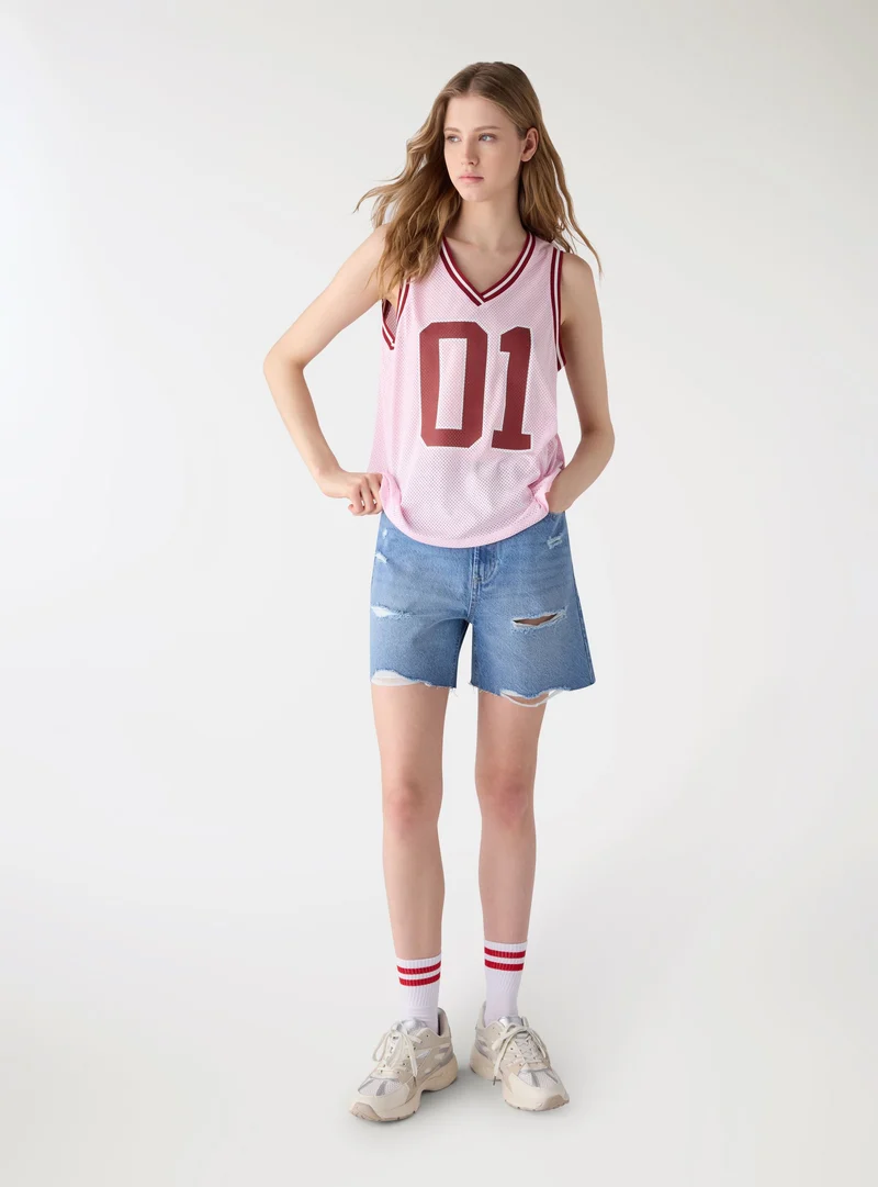 Shorts bermuda in denim con strappi