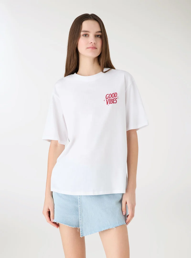 T-shirt ampia con stampa fronte/retro